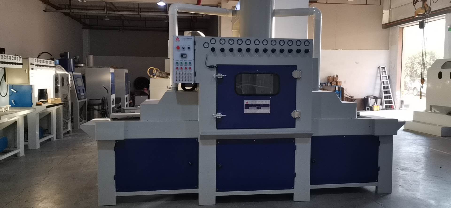 輸送式自動噴砂機(jī)